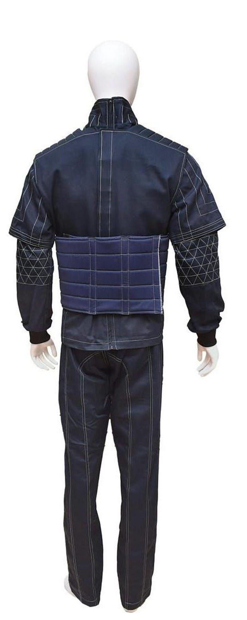 May include: Navy blue protective suit with white stitching. The suit features a jacket with quilted shoulder pads and matching trousers. A padded belt is worn around the waist. The suit is displayed on a mannequin.