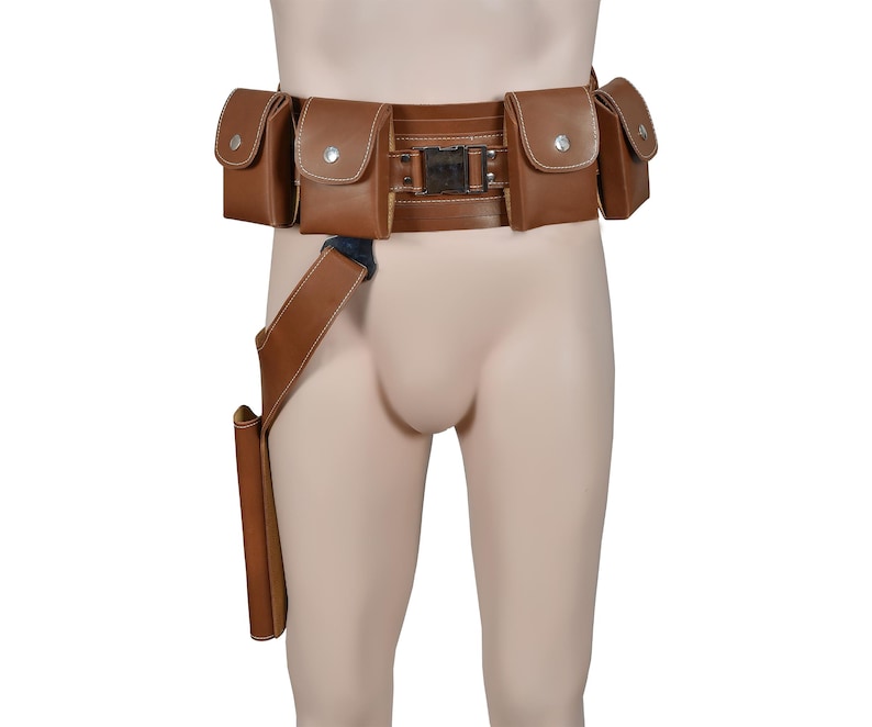 Puede incluir: Un cintur&oacute;n de cuero marr&oacute;n con m&uacute;ltiples bolsas y una funda adjunta. El cintur&oacute;n tiene una hebilla de metal y detalles de costura.