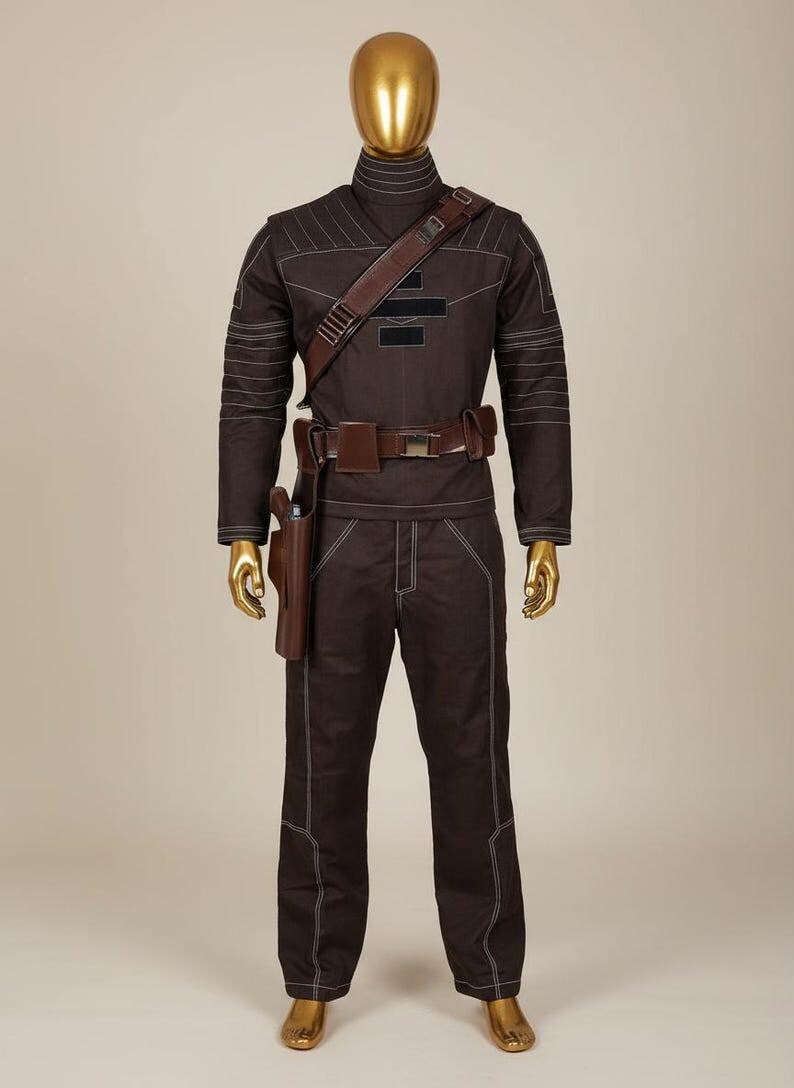 May include: A dark brown long-sleeved shirt and matching trousers set featuring white contrast stitching, a high collar, and a brown leather-like utility belt with a holster. The outfit includes a diagonal shoulder strap and black rectangular patches.