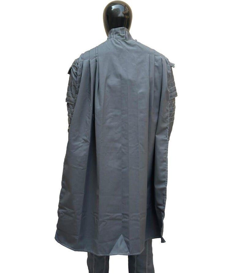 May include: A gray, long coat with a high collar and cape-like design. The coat is displayed on a mannequin, showcasing its tailored fit and structured silhouette. The fabric appears to be a medium-weight material.