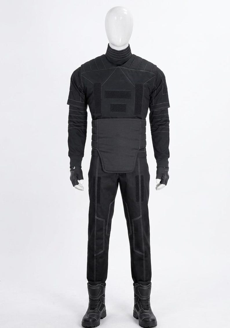 May include: Black tactical outfit, including a high-neck shirt, pants, gloves, and boots. The outfit features reinforced panels and stitching details. The mannequin is wearing a complete set of protective gear, suitable for cosplay or costume events.