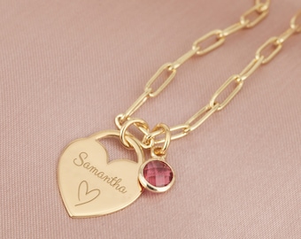 May include: Gold necklace with a heart-shaped pendant engraved with the name "Samantha" and a small pink gemstone charm.