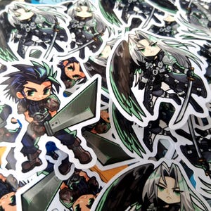 May include: A collection of die-cut vinyl stickers featuring chibi-style anime characters. One character has spiky dark hair and holds a large broadsword, while another has long silver hair, a single black wing, and a katana-style sword.