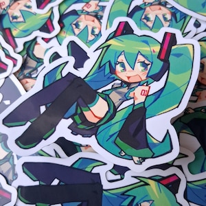 May include: A sticker featuring a cartoon character with long, turquoise hair and green eyes. The character is wearing a black and green outfit and holding up a hand with the number 01 on it. The sticker has a white border and is surrounded by other similar stickers.