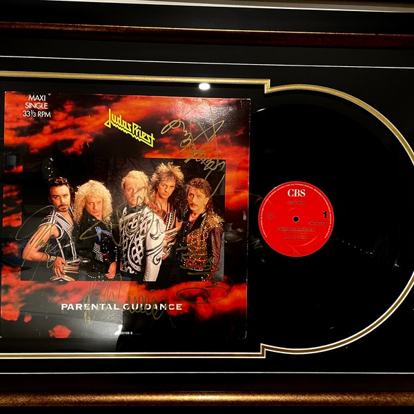 Judas Priest Signed 'Parental Guidance' single vinyl.  Signed by Rob Halford, K. K. Downing, Glenn Tipton, Ian Hill, & Dave Holland.