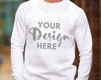 May include: White long-sleeve sweatshirt with the text "YOUR Design HERE" printed on the front.