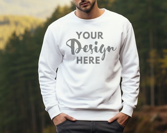 May include: White sweatshirt with a crew neck and long sleeves. The sweatshirt has the text "YOUR Design HERE" printed on the front in a gray, cursive font.