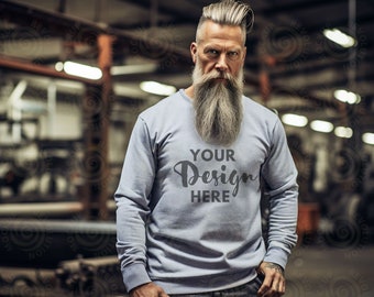 May include: A light blue long-sleeved sweatshirt with the text "YOUR Design HERE" printed in black on the front.