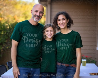 May include: A family of three wearing matching green t-shirts with the text "Your Design Here" printed on them. The family is standing in front of a wooden wall.