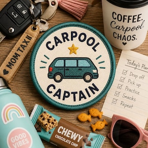 May include: A round embroidered patch with the words "CARPOOL CAPTAIN" and a teal van illustration. The patch is surrounded by a teal border. Other items include a coffee cup, snacks, sunglasses, and a keychain that says "MOM TAXI".