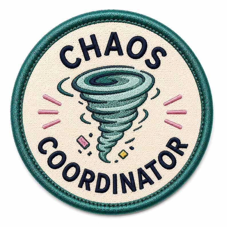 May include: Embroidered patch with the words "CHAOS COORDINATOR" in navy blue, surrounding a teal tornado graphic. The patch has a cream-colored background with a teal border and pink and yellow accents.