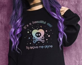 May include: Black sweatshirt with a rainbow graphic of a skull in a heart with stars and the text "It's a beautiful day to leave me alone".