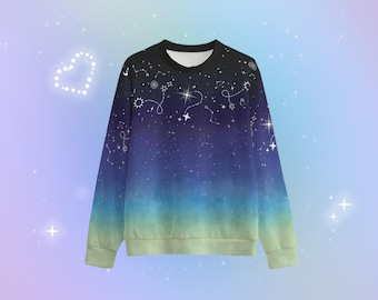 May include: A blue and green ombre sweatshirt with a white constellation print. The print features stars, moons, and constellations.