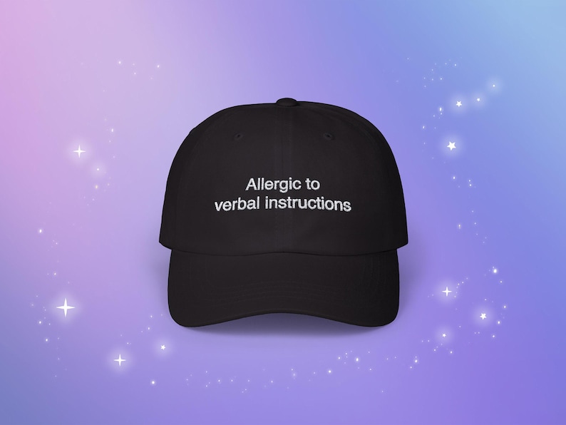 May include: A black baseball cap with white text that reads "Allergic to verbal instructions".