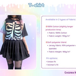 May include: Black T-shirt with a colorful skeleton design. The shirt has short sleeves and is paired with a black pleated skirt. The text "T-shirt" is at the top of the image. The shirt is available in two fabric types: 100% cotton and a soft polyester blend.