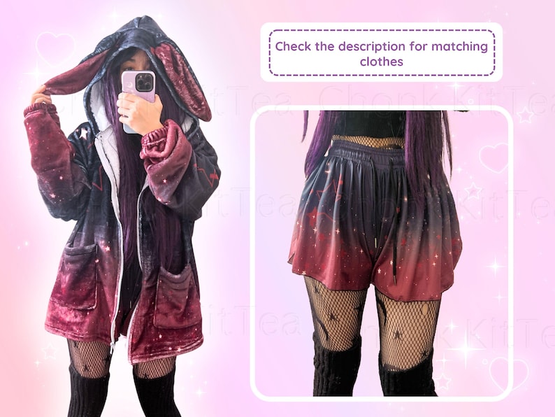 May include: A red and black hooded jacket with bunny ears and a galaxy print. The jacket is worn over a black shirt and black leggings. The person is holding a phone in front of their face. The image also shows a pair of red and black shorts with a galaxy print.
