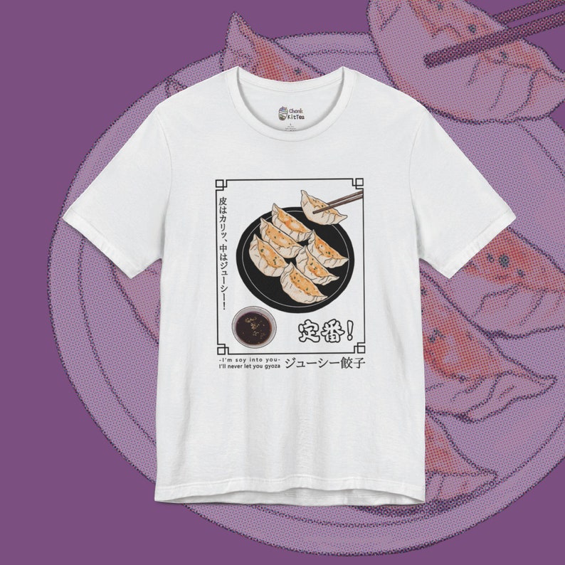 May include: White t-shirt with a graphic of a plate of dumplings, chopsticks, and a small bowl of dipping sauce. The text on the shirt reads "皮はカリッ、中はジューシー!" "定番!" "ジューシー餃子" and "I'm say into you I'll never let you gyoza".