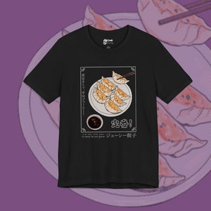 May include: Black t-shirt with a graphic of a plate of dumplings, chopsticks, and a small bowl of dipping sauce. The text "皮はカリッ、中はジューシー!" (Pi wa karri, naka wa juushi!) and "定番!" (Teban!) are written in Japanese. The text "ジューシー餃子" (Juushi Gyoza) and "I'm say inte you I'll never let you groza" are written in English.