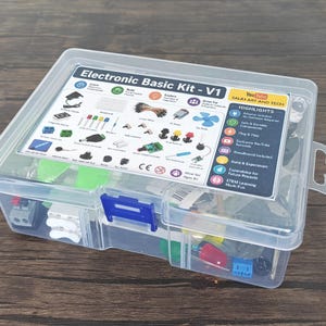 May include: A clear plastic storage box containing an Electronic Basic Kit - V1. The lid features a printed label with diagrams of electronic components, including LEDs, a breadboard, and buttons, along with a list of highlights and YouTube branding.