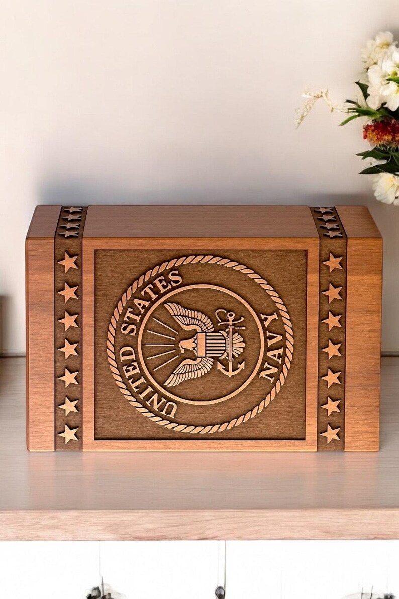 Memorial urn box with US Navy logo silhouette, perfect for cremation ashes.

Personalized US Navy urn box, custom engraved with a Navy logo silhouette.

Handmade wooden urn for ashes, featuring US Navy logo engraving.

Rosewood military urn box, custom engraved with US Navy logo for ashes.

Custom engraved US Navy urn, handcrafted from rosewood for cremation ashes.

Wooden urn with US Navy logo silhouette engraving for ashes of veterans