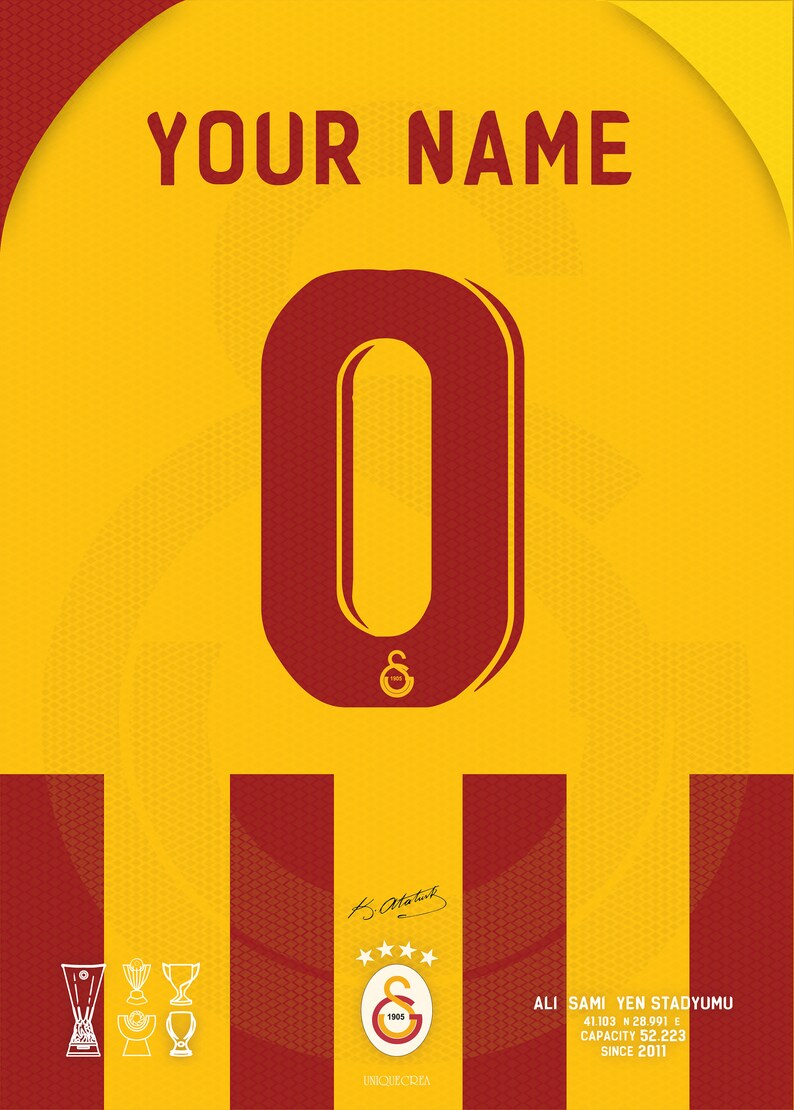 May include: A red and yellow soccer jersey with the number 0 on the front. The jersey has a white logo with the letters "S" and "G" and the number 1905. The text "YOUR NAME" is at the top of the jersey. The text "ALI SAMI YEN STADYUMU" is at the bottom of the jersey, along with the coordinates "41.103 N 28.991 E", the capacity "52.223", and the year "2011".