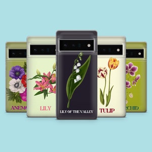 May include: Five phone cases with different floral designs. The cases are all black with a white border and feature the names "Anemone", "Lily", "Lily of the Valley", "Tulip", and "Orchid" printed on them.