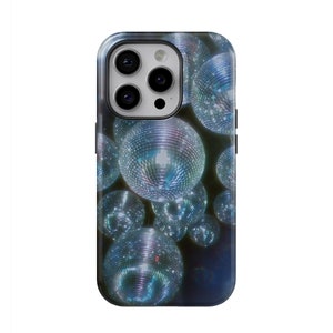 May include: A phone case with a design of multiple disco balls in shades of blue and silver. The case is designed for a phone with a camera bump.