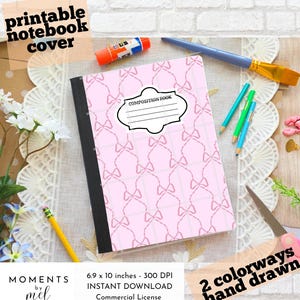 May include: A pink composition notebook cover with a bow pattern, the text "COMPOSITION BOOK" is on the cover. The cover is 6.9 x 10 inches. The words "printable notebook cover" and "2 colorways hand drawn" are also visible.