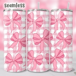 May include: Pink and white gingham pattern with pink bows on a tumbler. The tumbler is seamless and has a straw.
