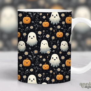 May include: White ceramic mug with a black background and a repeating pattern of white ghosts and orange pumpkins with green stems. The pattern is surrounded by white flowers and green leaves.