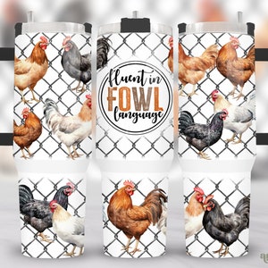 May include: A white stainless steel tumbler with a black handle and lid. The tumbler features a design of chickens in a wire fence with the text "Fluent in Fowl Language".