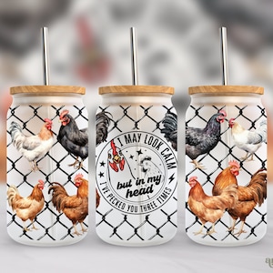 May include: Three white tumblers with a black wire fence design and watercolor chickens. The tumblers have wooden lids and straws. The middle tumbler has a black and white graphic with the text "I may look calm but in my head I've pecked you three times".