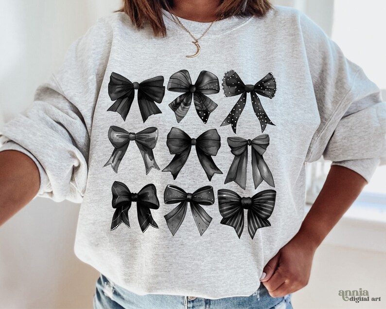 May include: A gray sweatshirt with a black and white design of nine bows. The bows are arranged in three rows of three.
