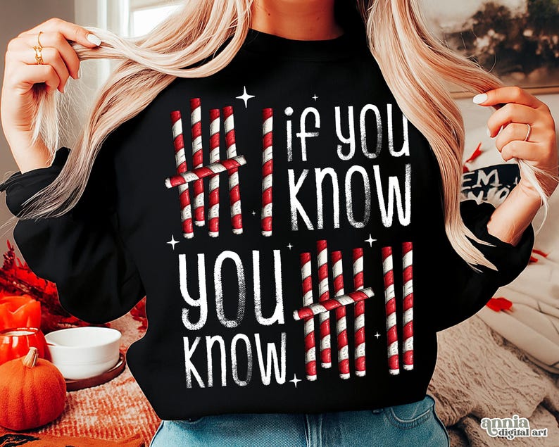 May include: Black sweatshirt with the text "If you know, you know" in white. The design includes red and white striped candy cane-like graphics. The sweatshirt is a festive holiday-themed apparel item.
