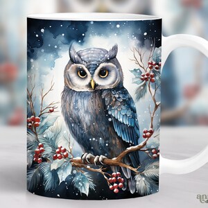 May include: White ceramic mug with a blue and gray owl perched on a branch with red berries. The owl is surrounded by a snowy winter scene.