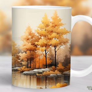Peut inclure: Une tasse en céramique blanche avec une peinture à l'aquarelle d'une scène de forêt. Les arbres sont peints dans des tons de jaune et de brun, et l'eau est d'un bleu réfléchissant. La tasse a une poignée blanche.