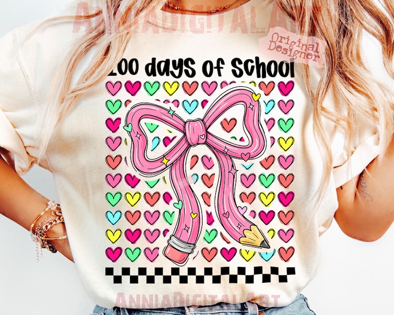 May include: A light-colored t-shirt featuring a large pink bow and pencil design with the text "200 days of School". The design includes colorful hearts and a black and white checkered border, perfect for celebrating the school year.