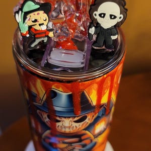 Horror themed 20 oz straight tumbler.  Including handmade horror topper.