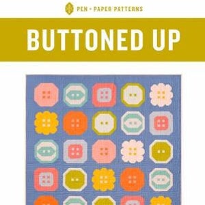 May include: A quilt pattern called "Buttoned Up" featuring a blue background with a grid of colorful buttons in various shapes and sizes. The pattern is for an advanced beginner sewist.
