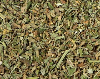 May include: Close-up of a mix of dried herbs, including green, brown, and tan leaves and stems. The herbs are densely packed, creating a textured, natural appearance. The image suggests a culinary or herbal product.
