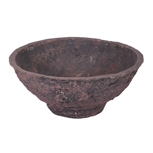 May include: A rustic, brown bowl with a textured surface. The bowl has a wide, open top and a slightly rounded base. The color is a deep, earthy brown with variations in tone, suggesting a natural, handcrafted appearance. The bowl is likely used for serving or display.