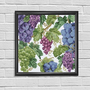 May include: A cross-stitch pattern featuring a cluster of grapes in various shades of purple, green, and blue. The grapes are arranged on a white background with green vines and leaves.
