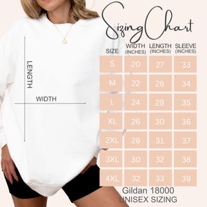 May include: Sizing chart for Gildan 18000 unisex sizing. The chart shows the width, length, and sleeve length in inches for sizes S through 4XL.