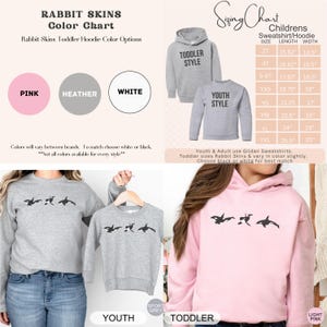 May include: A color chart for Rabbit Skins toddler hoodies, showing three color options: pink, heather grey, and white. The chart also includes a sizing chart for children's sweatshirts and hoodies, with measurements in inches. The image shows a toddler hoodie in grey, a youth hoodie in grey, and a toddler hoodie in pink.