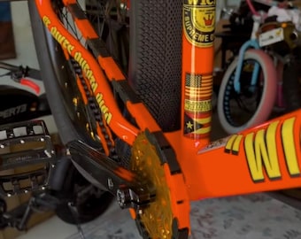 Cubrecadenas de bicicleta negros y naranjas – Tapas de cadena a presión – Aptas para bicicletas infantiles, BMX, cruisers y eléctricas - Accesorio para bicicletas
