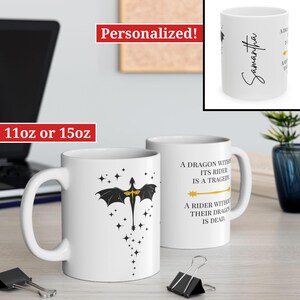May include: White ceramic mug with a black dragon silhouette and gold accents. The mug has the text "A dragon without its rider is a tragedy. A rider without their dragon is dead." printed on it. The mug is available in 11oz or 15oz sizes.