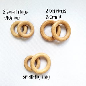 May include: Three sets of wooden rings in various sizes. Two small rings, 40mm in diameter, two large rings, 50mm in diameter, and one set of a small and large ring together.