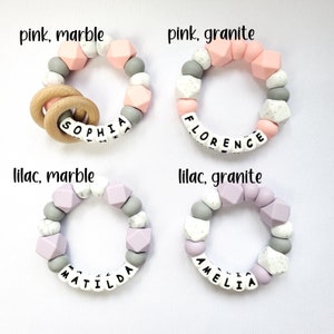 May include: Four silicone teething bracelets with different color combinations and names spelled out on them. The bracelets are pink and white marble, pink and white granite, lilac and white marble, and lilac and white granite.