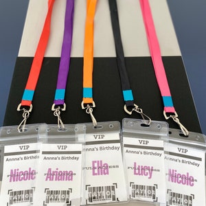 May include: Five clear plastic badge holders with colorful lanyards. Each badge holder has the text "VIP" and "Anna's Birthday" printed on it. The names "Nicole", "Ariana", "Ella", "Lucy", and "Nicole" are printed on the badges.