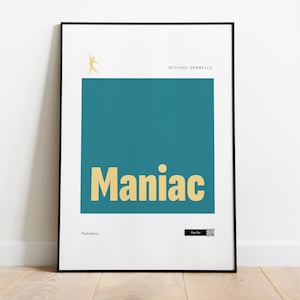 May include: A black framed poster with a teal background and the word "Maniac" in yellow text. The artist's name, "Michael Sembello", is printed in black text at the top of the poster.